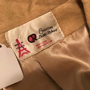 Tan knee length trench coat 1970